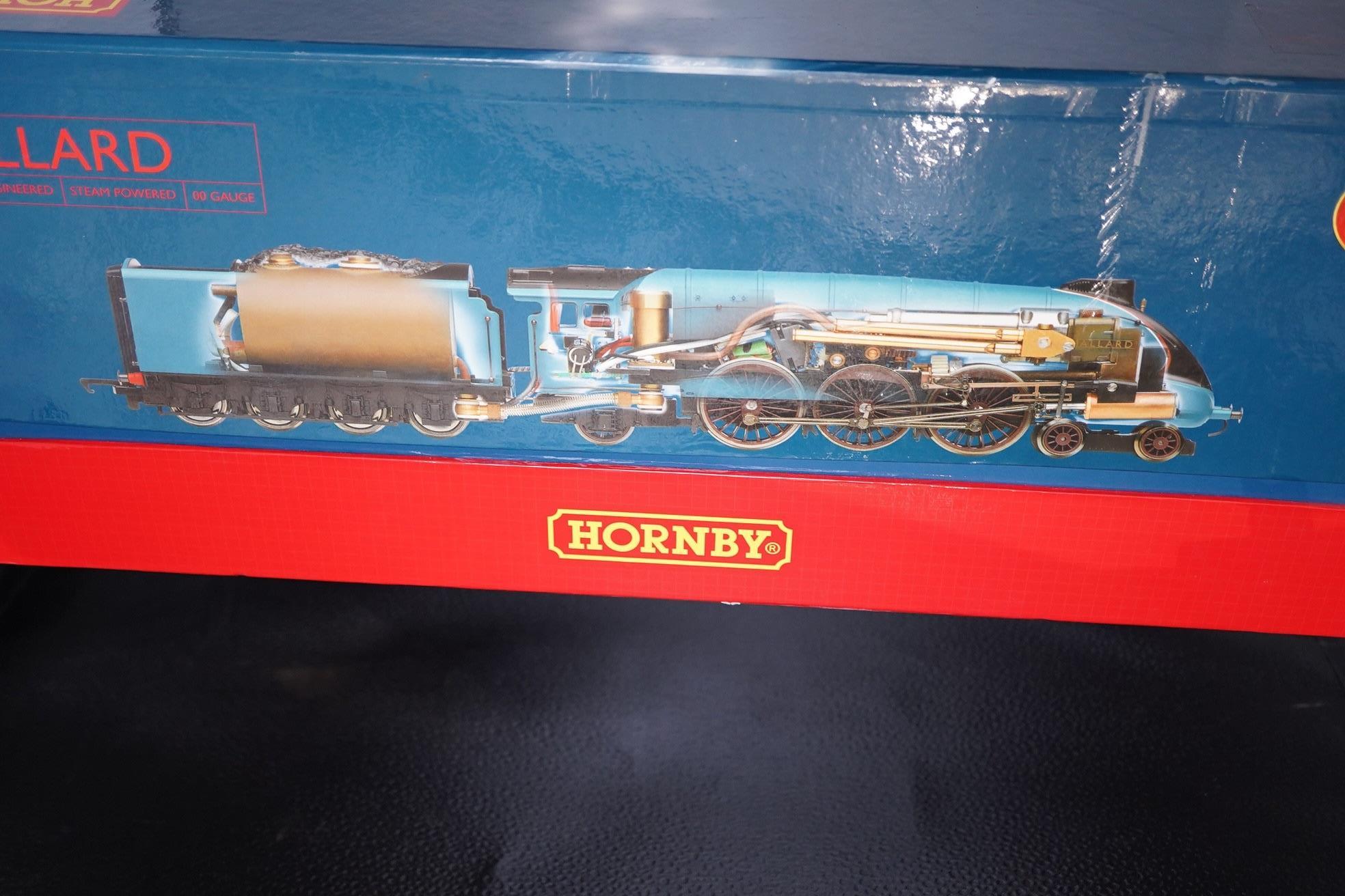 A boxed Hornby Hobbies 00 gauge railway live steam train set, comprising of an LNER Class A4 locomotive, Mallard, a quantity of track sections, controllers, and other accessories. Condition - good, appears unused with in